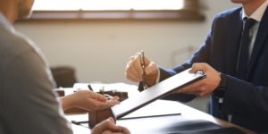 Bankruptcy attorney discussing a case with clients in office
