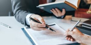 An attorney reviews bankruptcy documents with a client